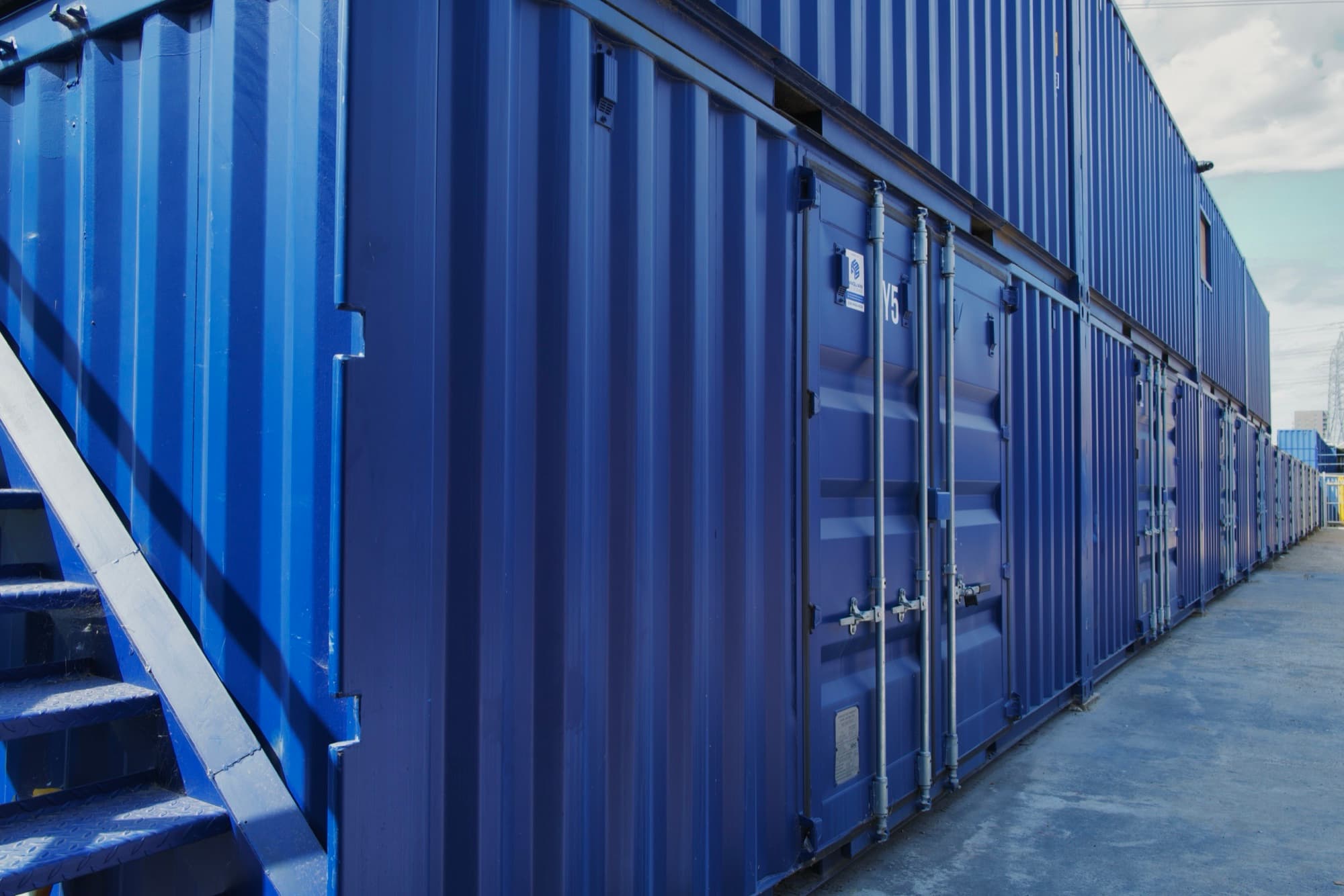 Row of storage containers for furniture storage