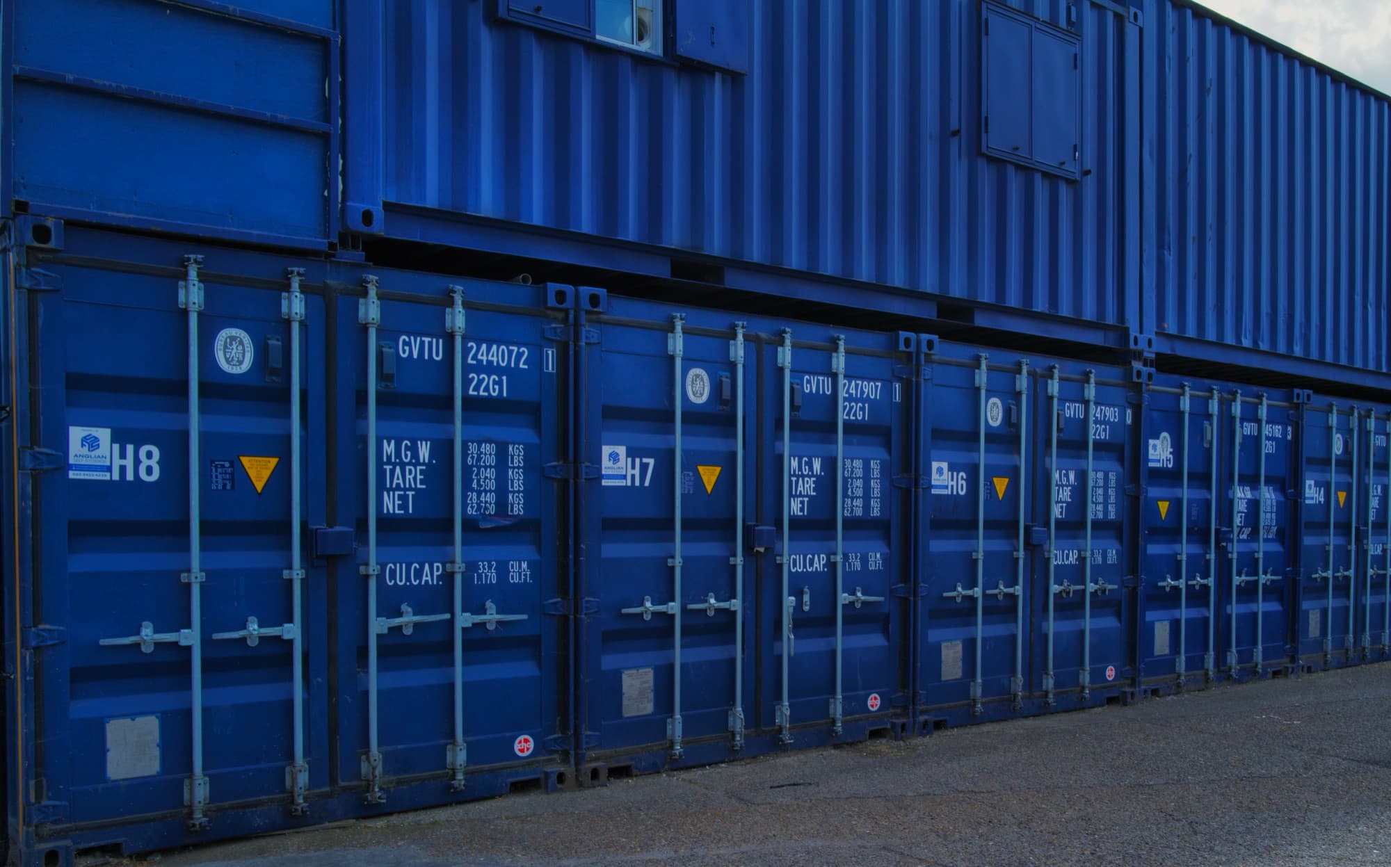 Row of storage containers for house moving storage